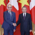スイスのギー・パルムラン大統領とベトナムのトー・ラム書記長兼国家主席