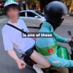 ホーチミン市内でバイクタクシーを利用する欧米人